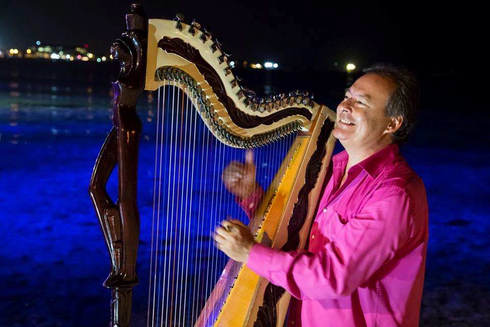 Harpist Extraordinaire: among the many attractions in the Cayman Islands!