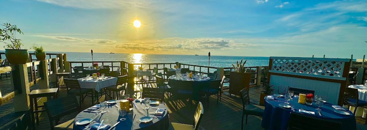 Where Can You Watch the Sunset While Dining in Grand Cayman?