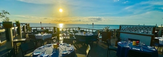 Where Can You Watch the Sunset While Dining in Grand Cayman?